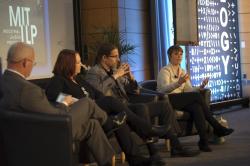 Panel speaking on stage