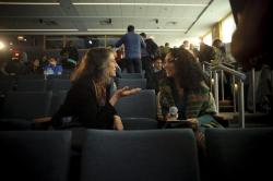 Two women speaking to each other in audience