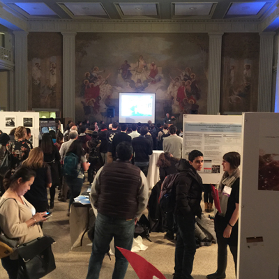 Water night attendees walking through poster sessions