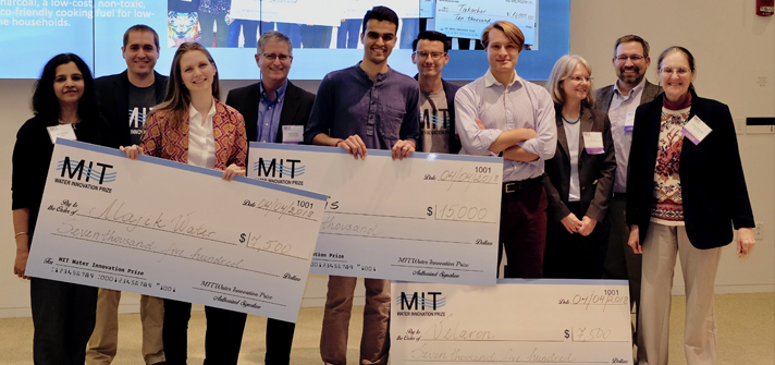 Winners of MIT Water Night holding checks