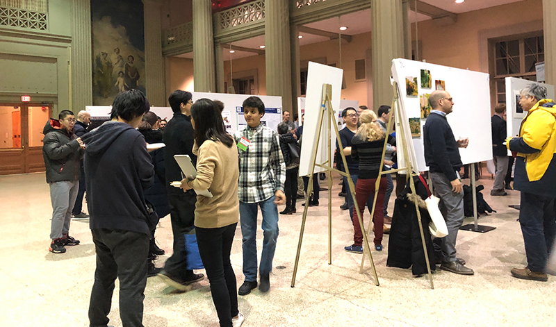 MIT Water Night attendees walking through poster session