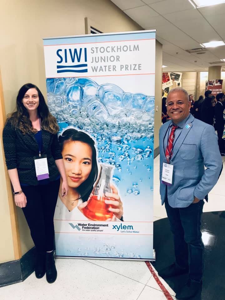 Water club members in front of Stockholm Junior Water Prize sign