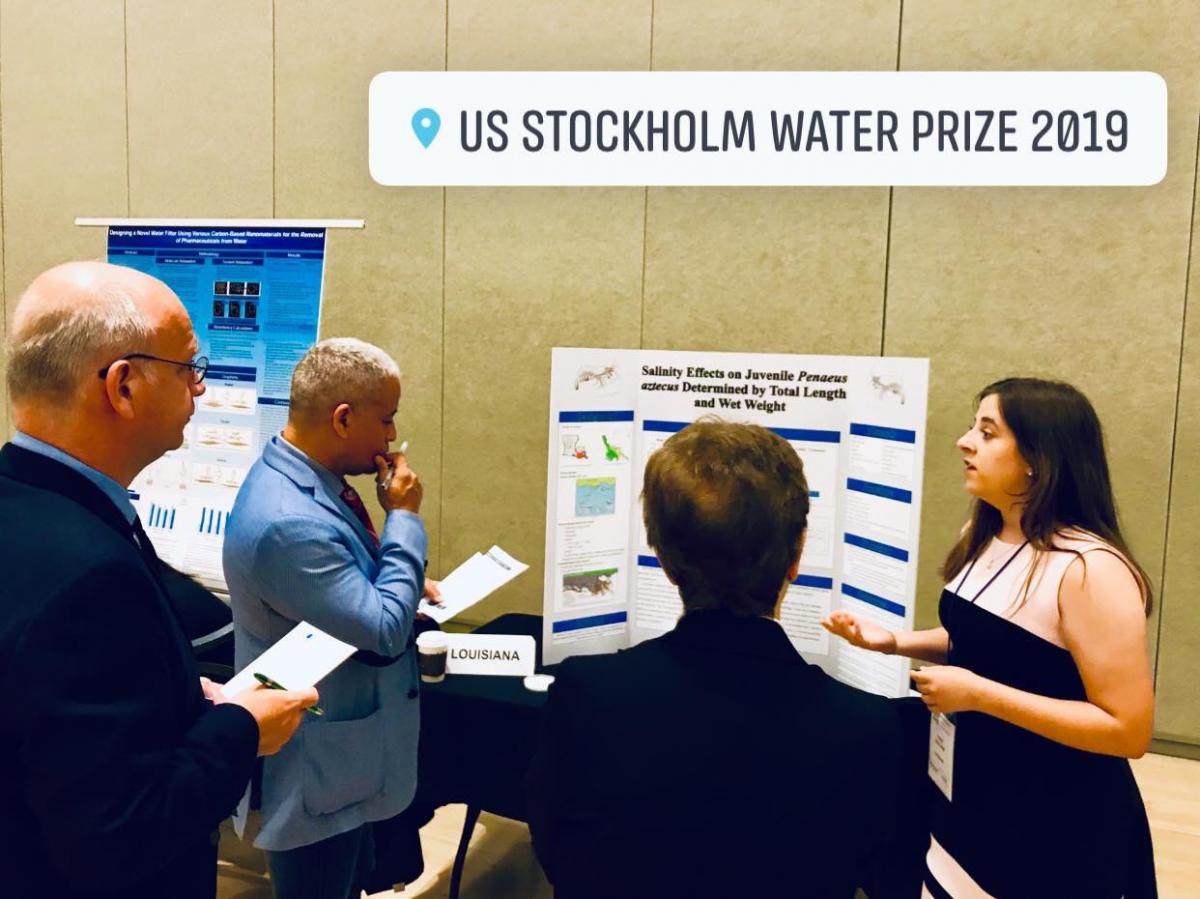 Student presenting project to judges