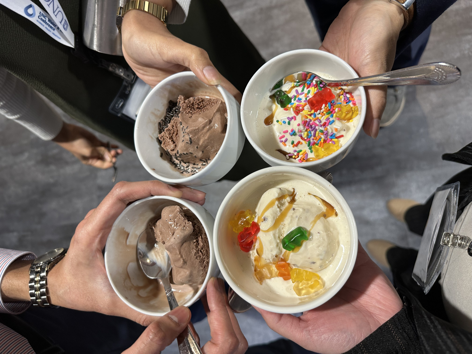 UNC travel grantees holding out their ice cream bowls.