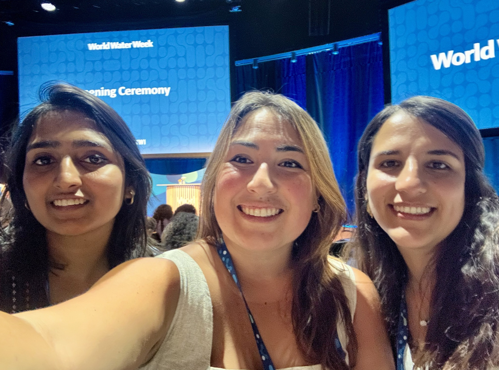 A selfie of Shubhi (left), Daniela (center), and Luisa (right), one of the conference's junior rapporteurs, in an auditorium