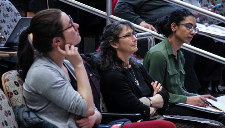 Renee Robins and others listening in audience