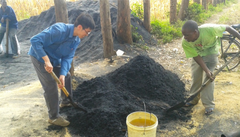 Kevin and another person digging