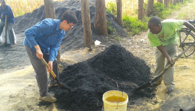 Kevin and another person digging 