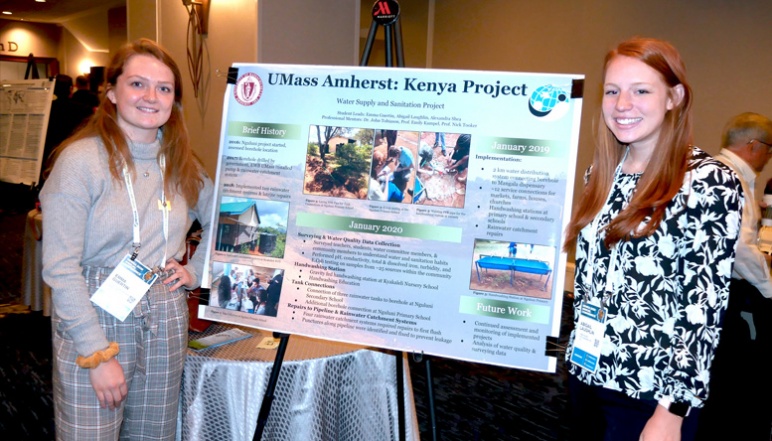 Emma Guertin and Abigail Laughlin with their research poster