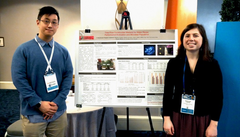 Paul Yi and Madeline DuBois with their research poster