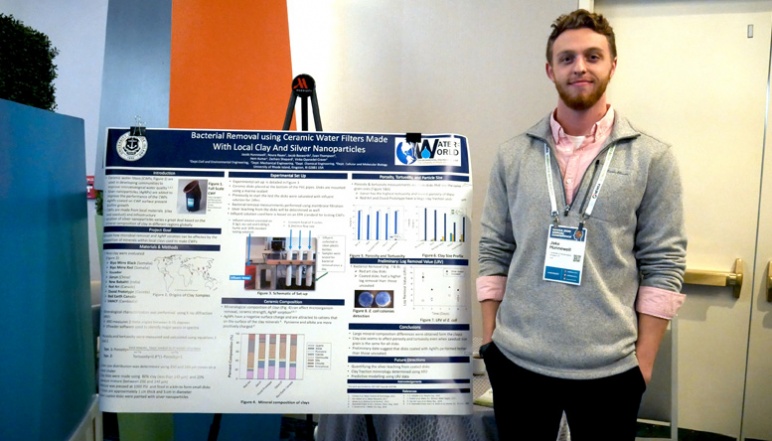 Jacob Hunnewell with his research poster