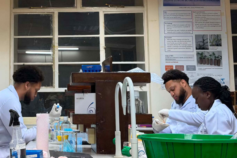 Miles George (left), Malik George (middle) and Mourine Mutati (right), work in the lab