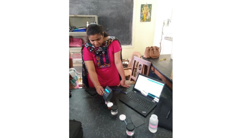 A laboratory manager from a Maharashtra Department of Agriculture Soil Testing Lab in Latur, Maharashtra conducts a test of a QuantiSoil prototype, funded by J-WAFS Solutions.