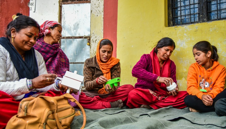 Local women assemble Xylem filters in circle