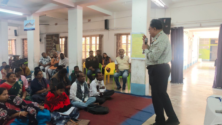 Jayanta Basu speaks to a group of people