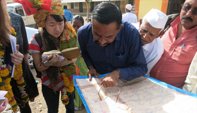 Research team in India looking at map