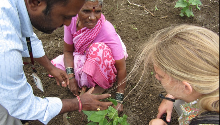Local Indian woman tells researchers about crops in fields