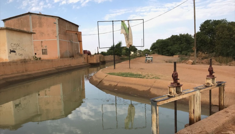 Water infrastructure with metal square frame reflected on water