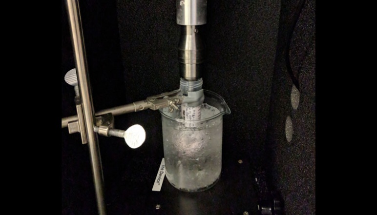 Vial with slide samples in ice beaker