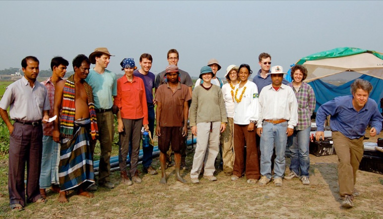 An outdoor photo of Harvey's research team and locals
