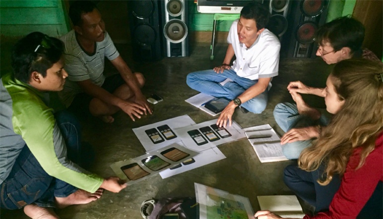 de Zegher and other researchers sitting indoors in a circle discussing plan