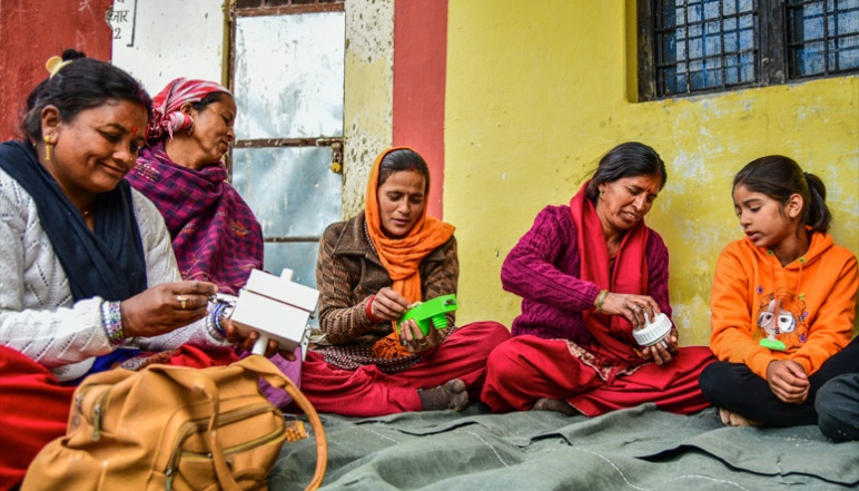 Local women assemble Xylem filters in circle