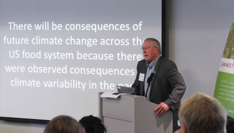 Bill Easterling presenting slide about consequences of climate change