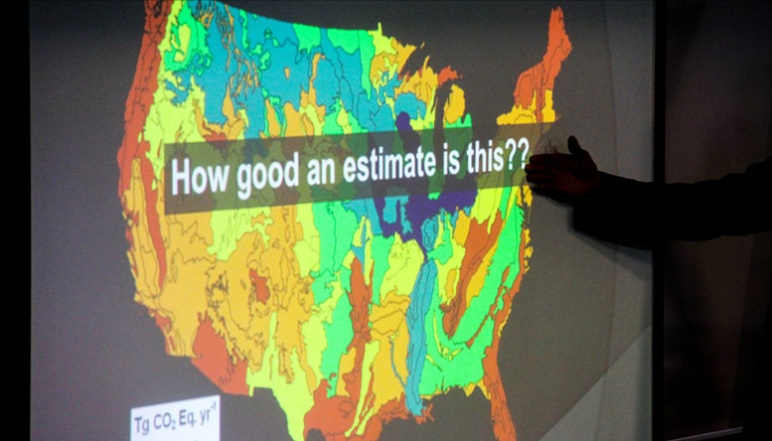 Hand gesturing to title of slide reading "How good an estimate is this??" atop a map of the United States