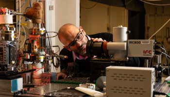 Associate Professor Matteo Bucci examining experimental equipment