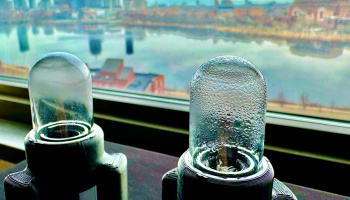 two water harvesting devices on a window sill