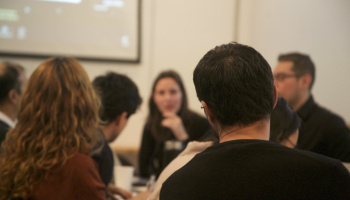 People looking at speaker during water workshop