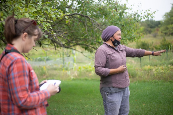 Journalism Fellow Nora Hertel (left) takes notes during a tour with Jessika Greendeer, seed keeper and farm manager for Dream of Wild Health, a Native American-led nonprofit with a farm just outside the Twin Cities in Hugo, Minnesota.