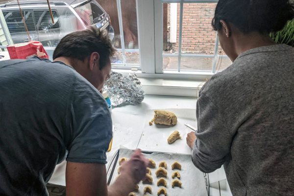 Graduate students in the lab of associate professor of chemistry Yogesh Surendranath work on the holiday cookies they gave to staff members and others that make their work possible all year.