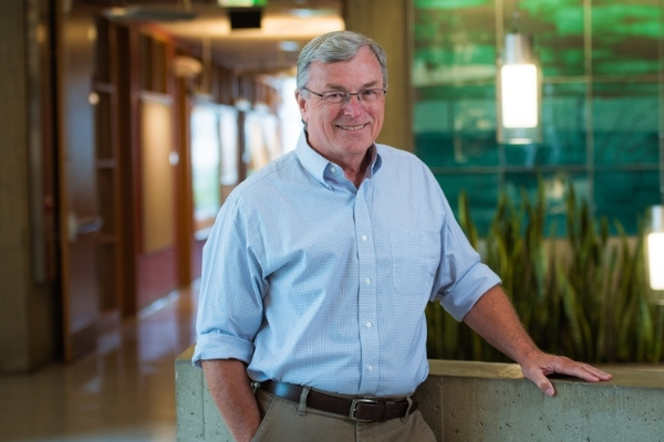T. Alan Hatton standing in a green office