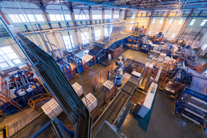 Aerial view of large industrial factory room with heavy equipment