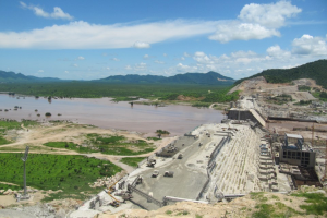 Grand Ethiopian Renaissance Dam on the Blue Nile River with blue sky above
