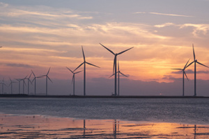 A photo of an evening sunset and windmills