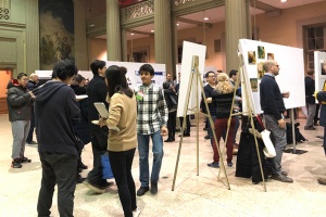 MIT Water Night attendees walking through poster session