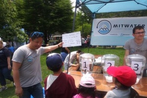 MIT Water club members running booth of water taste tests