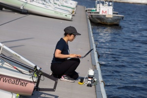 Charlene Xia researching seaweed by the ocean