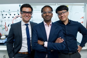 Karthish Manthiram (center) with two of his mentees
