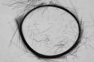 Close-up image of a circle of carbon fibers, which have a diameter of about 10 micrometers.