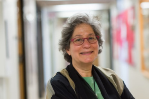 Headshot of Susan Solomon wearing red glasses