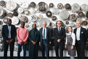 (From left to right) Dr. Guyo Roba, Eliud Rugut, Dr. Tarifa Al Zaabi, Bill Gates, Fady Jameel, Patricia Roig and Omar Shihab attend the Farming for our Future: Growing Climate Resilience breakfast event at COP28 in Dubai, UAE, 1 December, 2023. Art work: Maha Malluh, 'Food for thought', Al-Muallaqat 4, Art Jameel Collection
