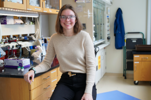 Alexis Hocken sitting inside a lab