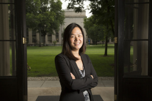 Evelyn Wang standing in Killian Court at MIT with a building and grass in the background