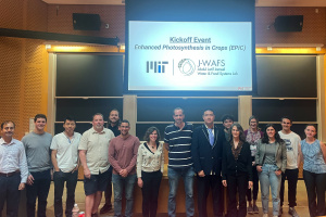 Group photo of the Epic research team and staff in front of a projector screen in a lecture hall