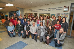 A large group of people, ranging in age, posing for a picture