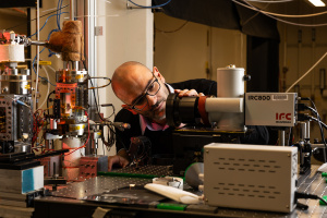 Associate Professor Mateo Bucci examining experimental equipment