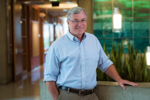 T. Alan Hatton standing in a green office